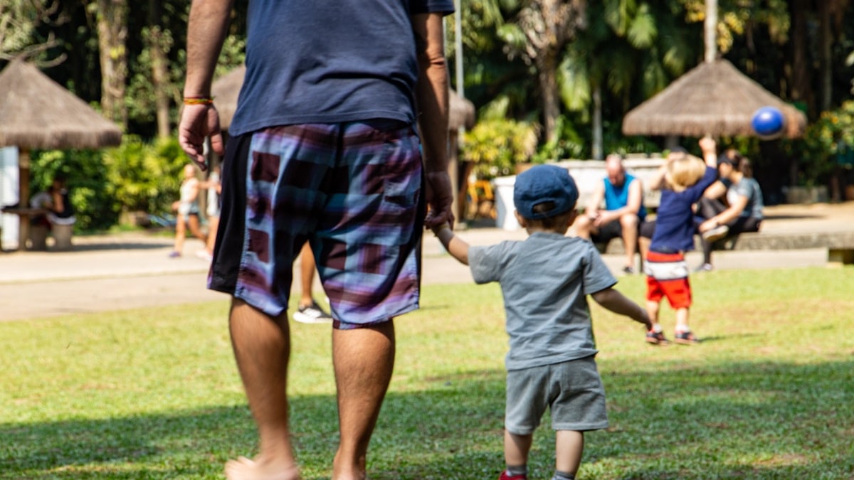 Legacy - Dad and son walking holding hands, walking in the park
